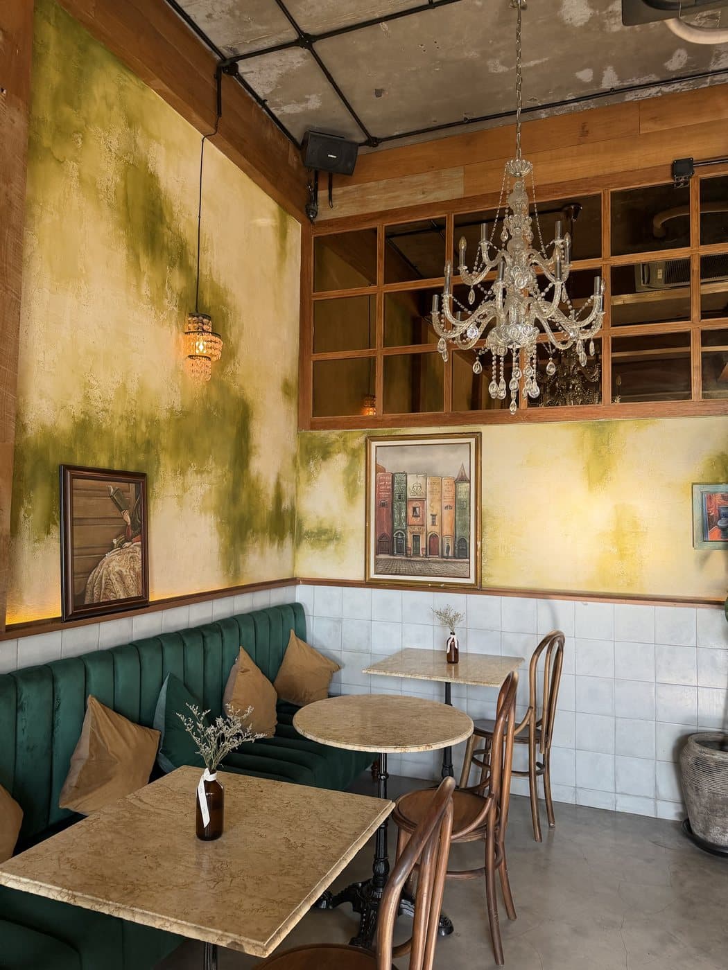 Example photo: a vintage café interior with a green velvet banquette
